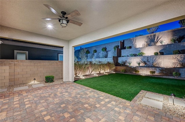 view of patio / terrace with a fenced backyard and ceiling fan