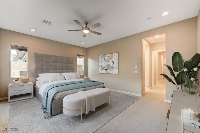 bedroom featuring recessed lighting, visible vents, light carpet, and baseboards