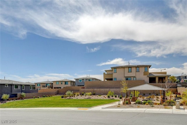 surrounding community featuring a lawn and fence