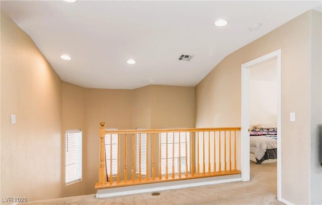 corridor with recessed lighting, visible vents, and carpet