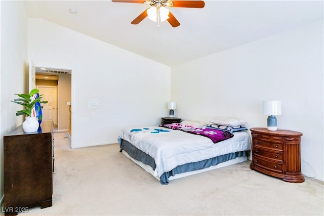 carpeted bedroom with lofted ceiling and a ceiling fan