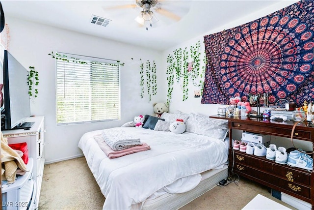 bedroom with visible vents, carpet flooring, baseboards, and ceiling fan