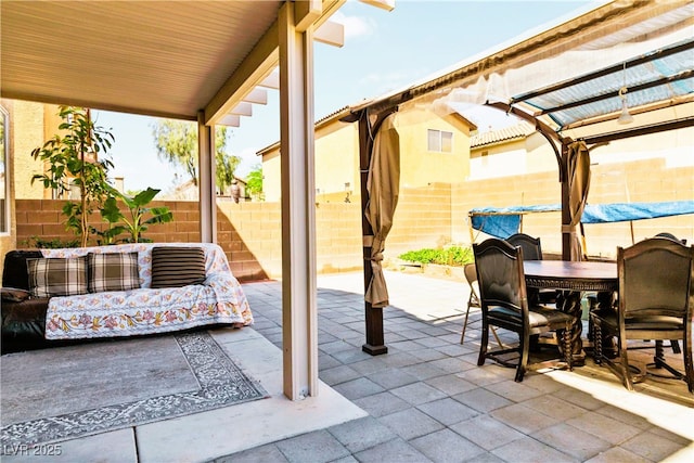 view of patio featuring outdoor dining area and a fenced backyard