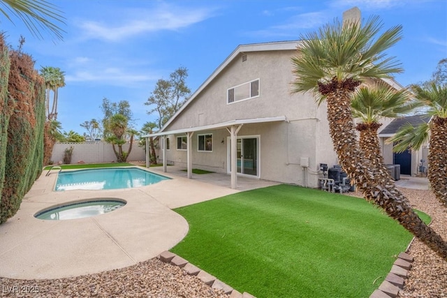 view of swimming pool with a fenced in pool, a lawn, a fenced backyard, a patio area, and an in ground hot tub