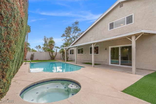 view of pool with a fenced in pool, a patio, an in ground hot tub, and a fenced backyard