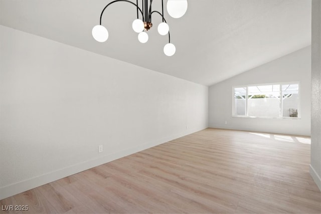 unfurnished living room with a chandelier, baseboards, wood finished floors, and vaulted ceiling