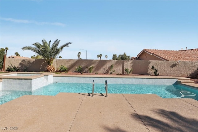 view of swimming pool featuring a patio area, a fenced in pool, an in ground hot tub, and a fenced backyard