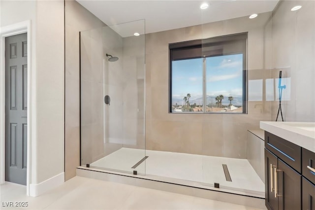 full bath with vanity, recessed lighting, and walk in shower