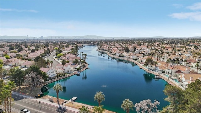 bird's eye view featuring a residential view and a water and mountain view