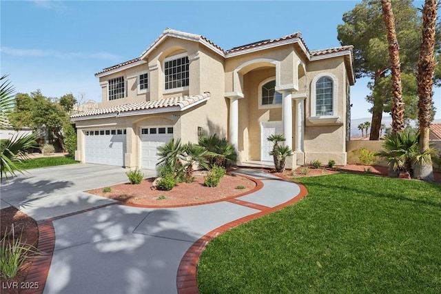 mediterranean / spanish-style house featuring stucco siding, driveway, a tile roof, a front yard, and an attached garage