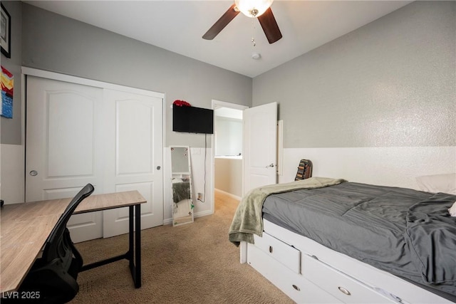 bedroom with a closet, carpet floors, and ceiling fan