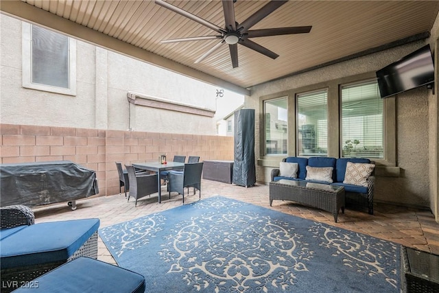 view of patio / terrace with ceiling fan, fence, an outdoor hangout area, outdoor dining area, and a grill