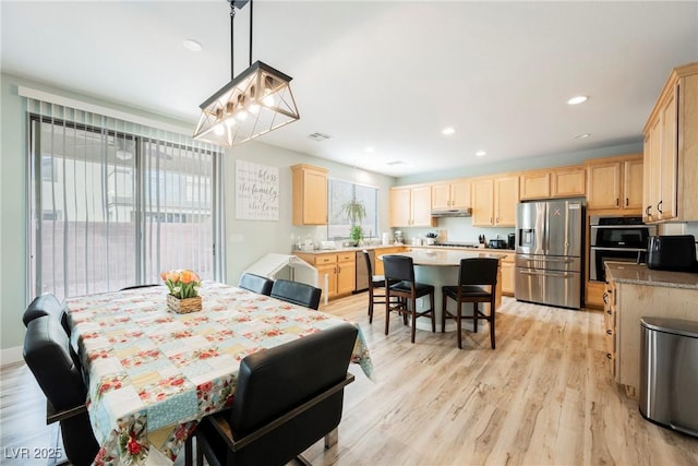 dining room featuring recessed lighting and light wood-style flooring