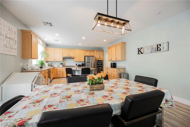 dining room with recessed lighting, visible vents, and light wood finished floors