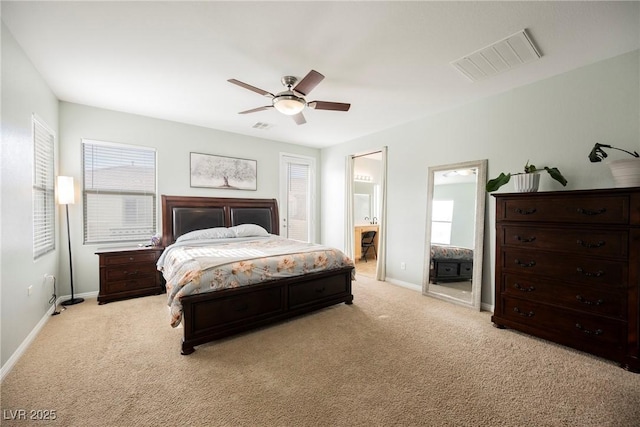 bedroom with light carpet, visible vents, multiple windows, and baseboards