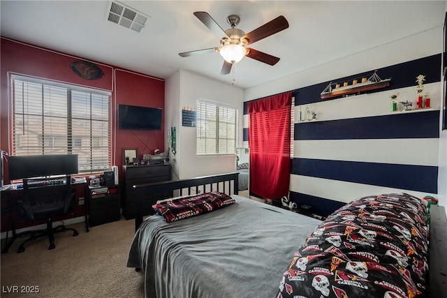 bedroom featuring visible vents, carpet floors, and ceiling fan