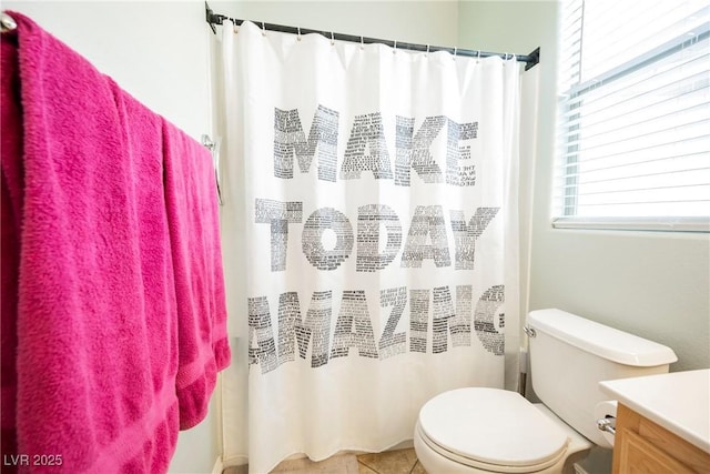 bathroom with a shower with curtain, toilet, vanity, and tile patterned flooring