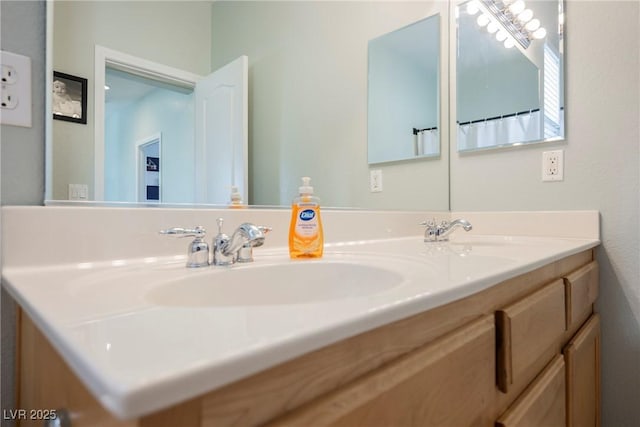 bathroom featuring double vanity and a sink