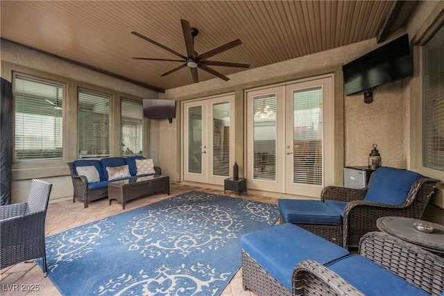 view of patio / terrace with an outdoor living space, french doors, and ceiling fan