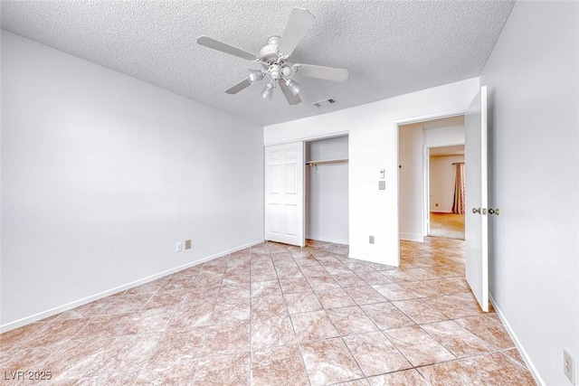 unfurnished bedroom featuring visible vents, a ceiling fan, a textured ceiling, a closet, and baseboards