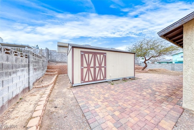 view of shed featuring a fenced backyard