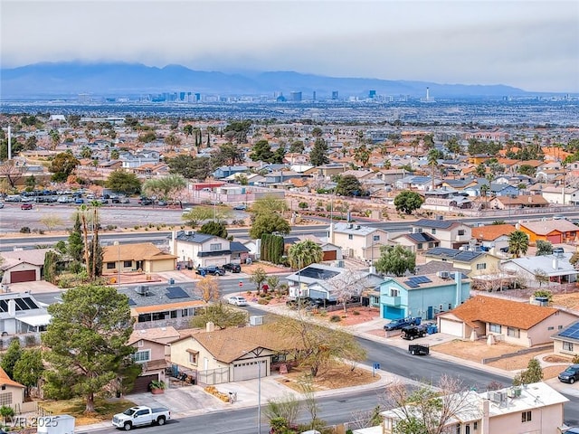 birds eye view of property with a mountain view and a residential view