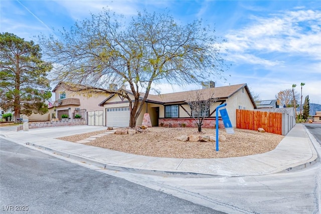 single story home featuring fence, concrete driveway, stucco siding, a chimney, and a garage