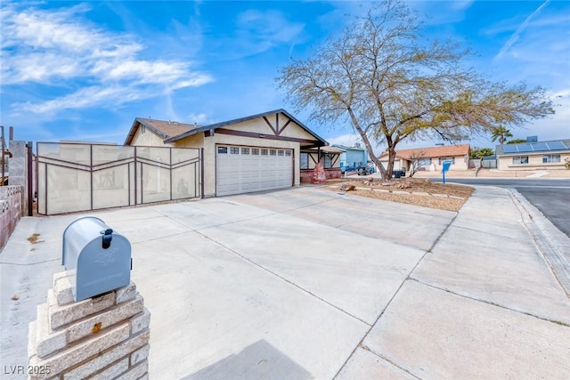 exterior space with concrete driveway and fence