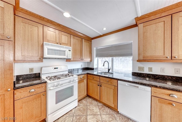 kitchen featuring a sink, recessed lighting, dark stone counters, white appliances, and light tile patterned floors