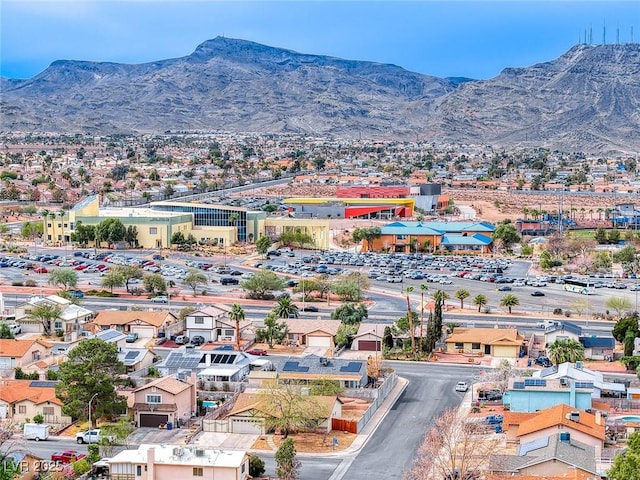 birds eye view of property with a mountain view