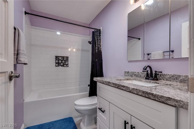 bathroom with toilet, shower / bath combo, and vanity