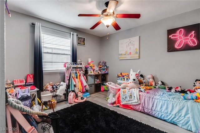 bedroom with ceiling fan and wood finished floors