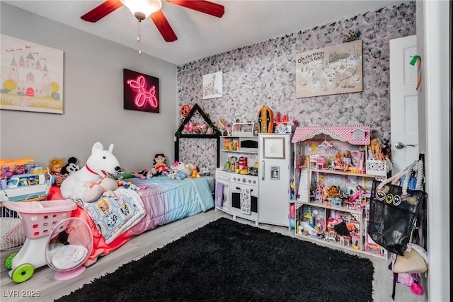 bedroom featuring a ceiling fan and wood finished floors