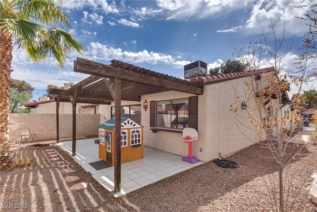 view of patio / terrace with central AC unit, a pergola, and fence