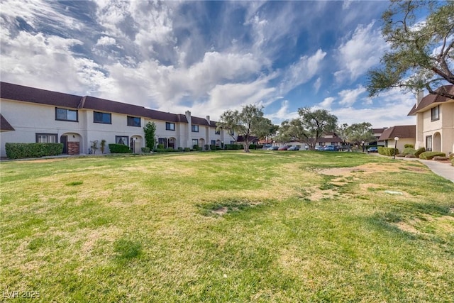 view of yard featuring a residential view