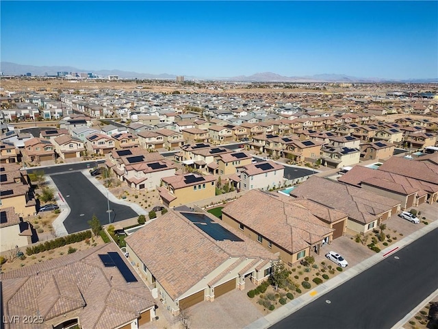 drone / aerial view featuring a residential view and a mountain view