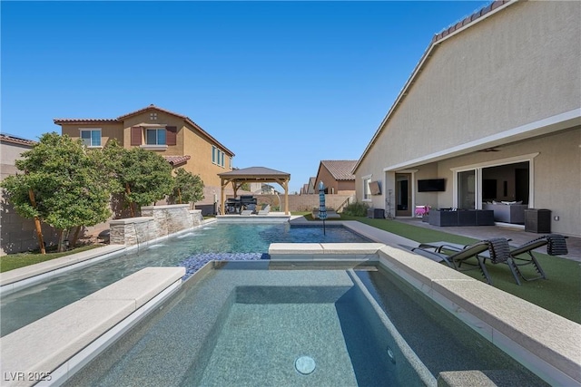 view of pool with a gazebo, a patio area, a pool with connected hot tub, and a fenced backyard