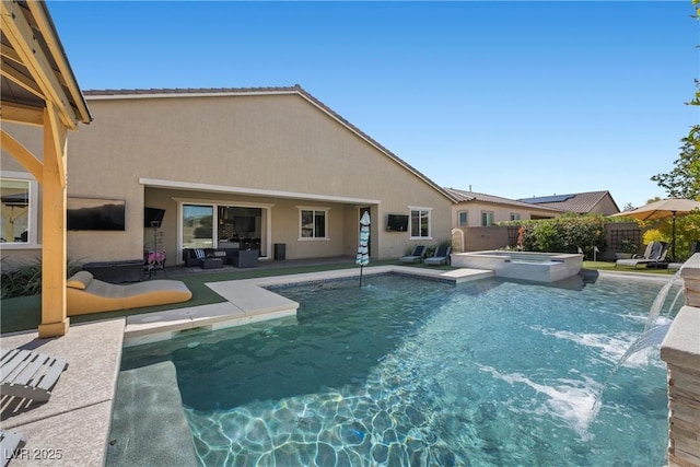 view of swimming pool featuring fence, a pool with connected hot tub, and a patio area