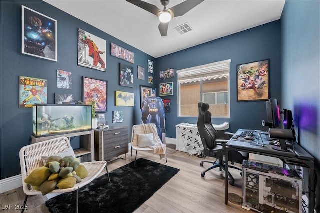 office area featuring visible vents, baseboards, ceiling fan, and wood finished floors