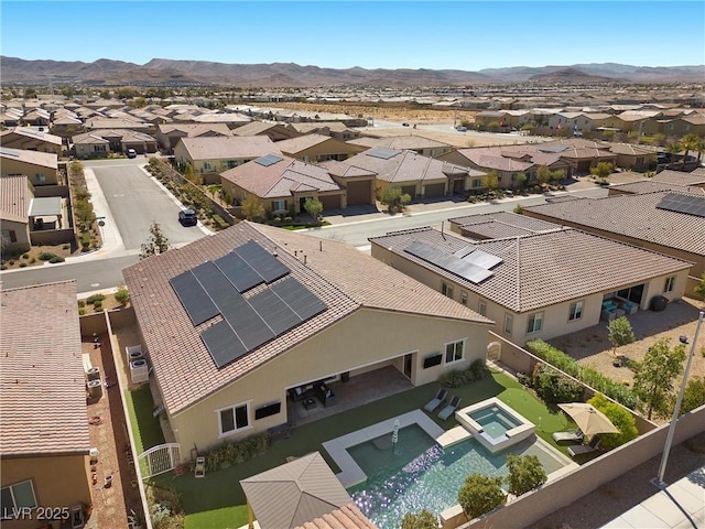 drone / aerial view with a residential view and a mountain view