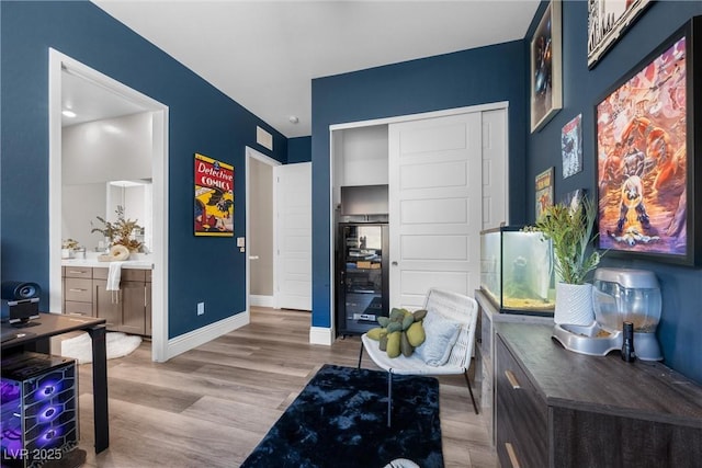 office with baseboards and wood finished floors