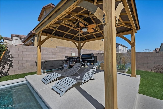 view of patio with a gazebo, area for grilling, and a fenced backyard