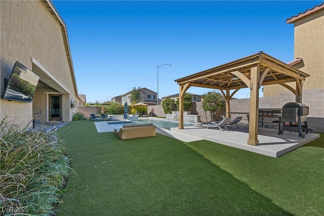 view of yard featuring a gazebo, a fenced backyard, and a patio area