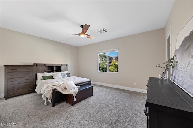 carpeted bedroom with visible vents, baseboards, and ceiling fan