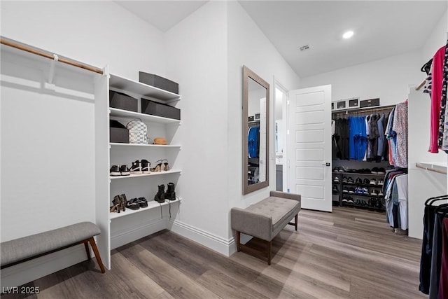 spacious closet with visible vents and wood finished floors