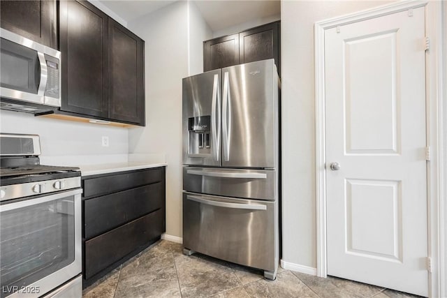 3158 Teaderman Walk, Henderson, NV 89044 - kitchen featuring stainless steel appliances, baseboards, dark brown cabinetry, and light countertops
