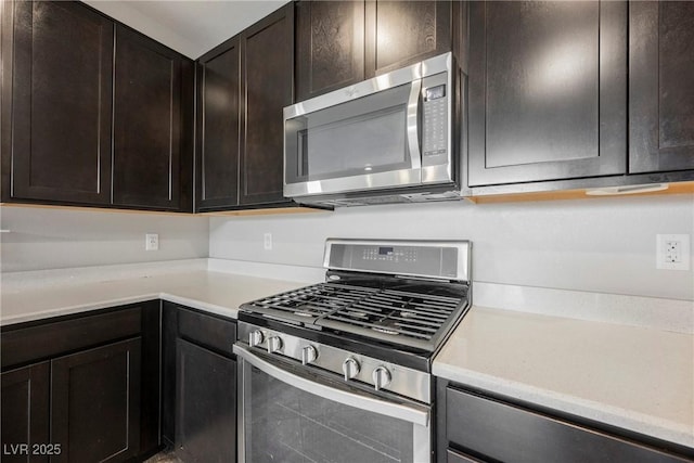 3158 Teaderman Walk, Henderson, NV 89044 - kitchen with appliances with stainless steel finishes, light countertops, and dark brown cabinets
