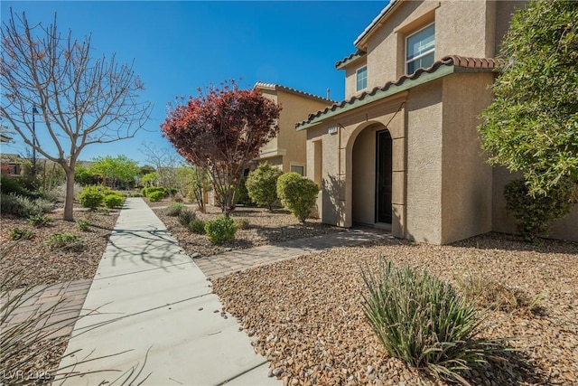 3158 Teaderman Walk, Henderson, NV 89044 - doorway to property with stucco siding and a tile roof