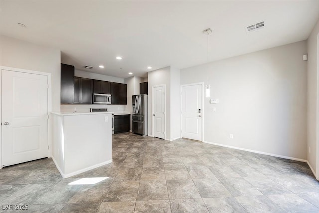 3158 Teaderman Walk, Henderson, NV 89044 - kitchen featuring stainless steel appliances, light countertops, baseboards, recessed lighting, and stone finish flooring