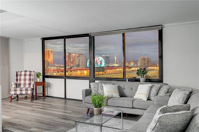 205 E Harmon Ave Unit 1010, Las Vegas, NV 89169 - living area featuring floor to ceiling windows, wood finished floors, and a city view